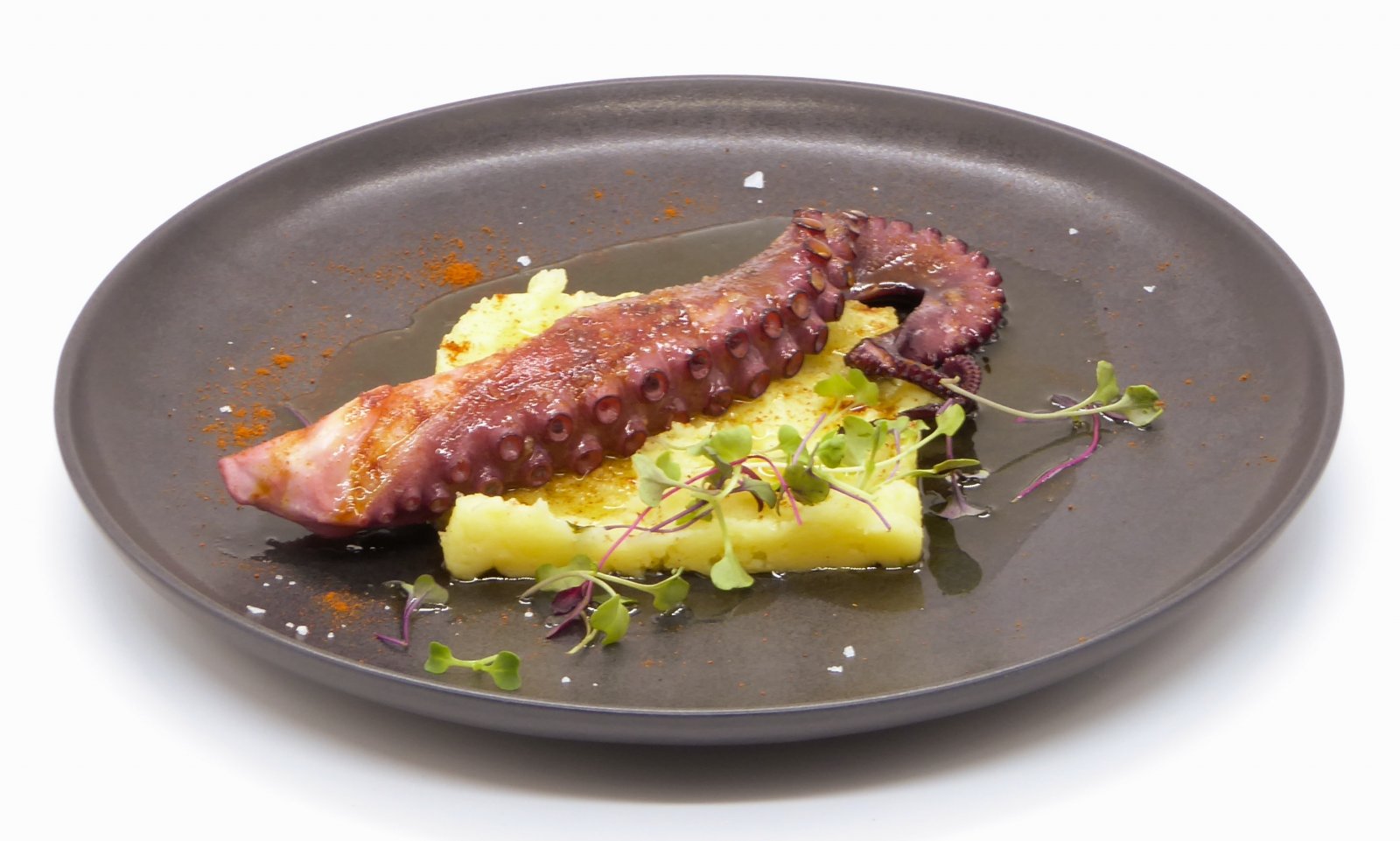 Pan fried octopus on a bed of mashed sweet potato and "Pimentón de La Vera" (Paprika)
